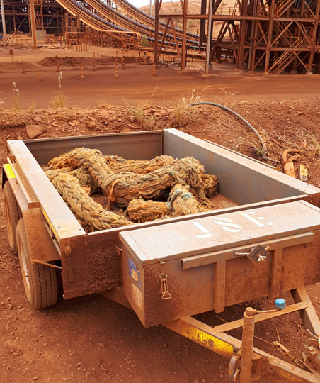 Old trailer on minesite with rope in it.