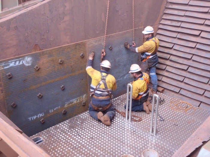 chute platform with workers at minesite