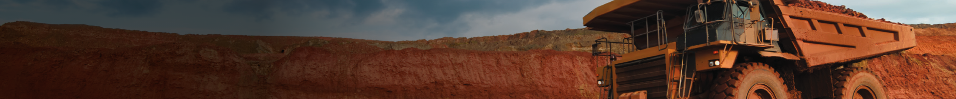 mining truck with red desert in background