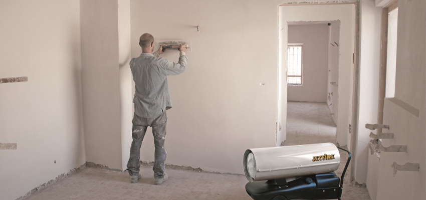 direct fired space heater being used by painter