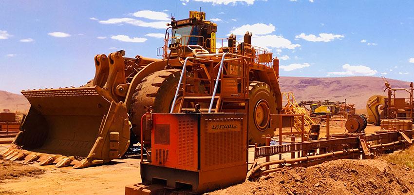 Spitwater Diesel Pressure cleaner on a minesite in front of a bulldozer