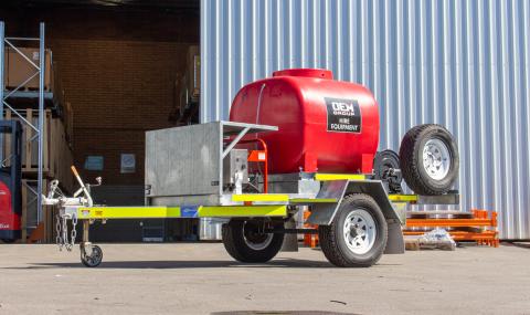 TSA-15210DEM High Pressure Cleaning Trailer Single Axle in front of Warehouse