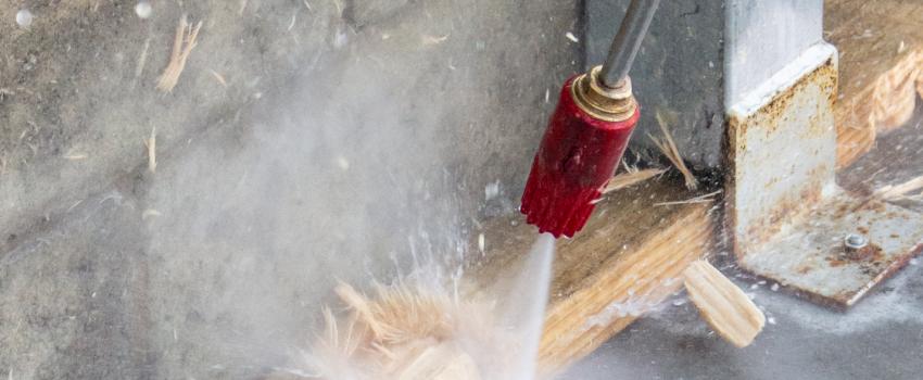 high pressure cleaner nozzle blasting though wood