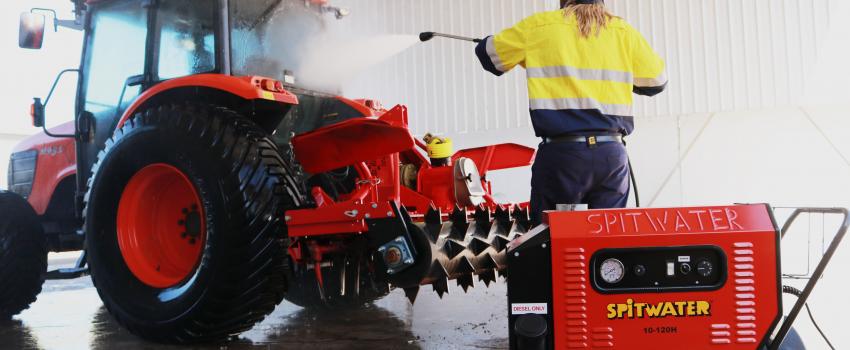 high pressure cleaning a tractor