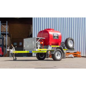 TSA-15210DEM High Pressure Cleaning Trailer Single Axle in front of Warehouse