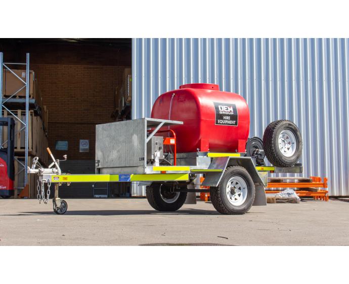 TSA-15210DEM High Pressure Cleaning Trailer Single Axle in front of Warehouse