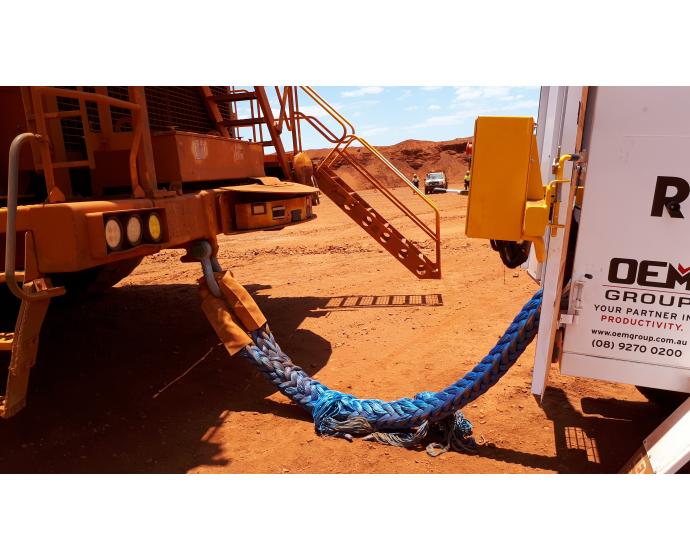 OEM Group recovery trailer on site with rope attached to dozer