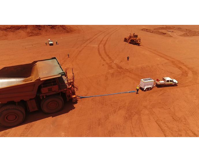 OEM Group recovery trailer on site with rope attached to dozer