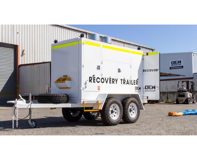 OEM Group recovery trailer in yard with trailer doors open