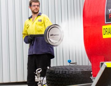 man using hydrofogger to clean