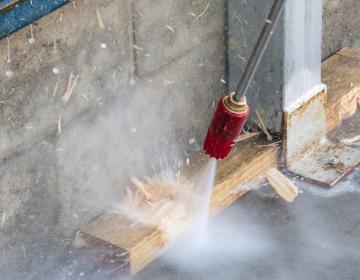 high pressure cleaner nozzle blasting though wood