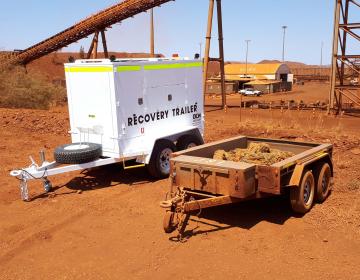 OEM Group's Recovery trailer next to an old trailer holding the rope on a minesite.